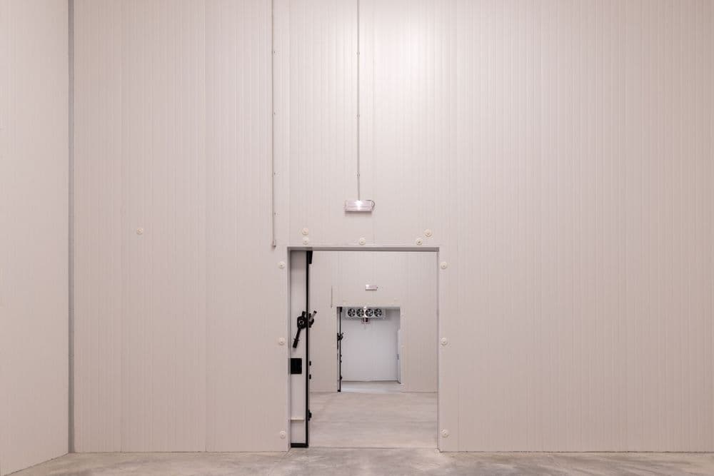 Primary refrigerated storage facility with temperature monitoring