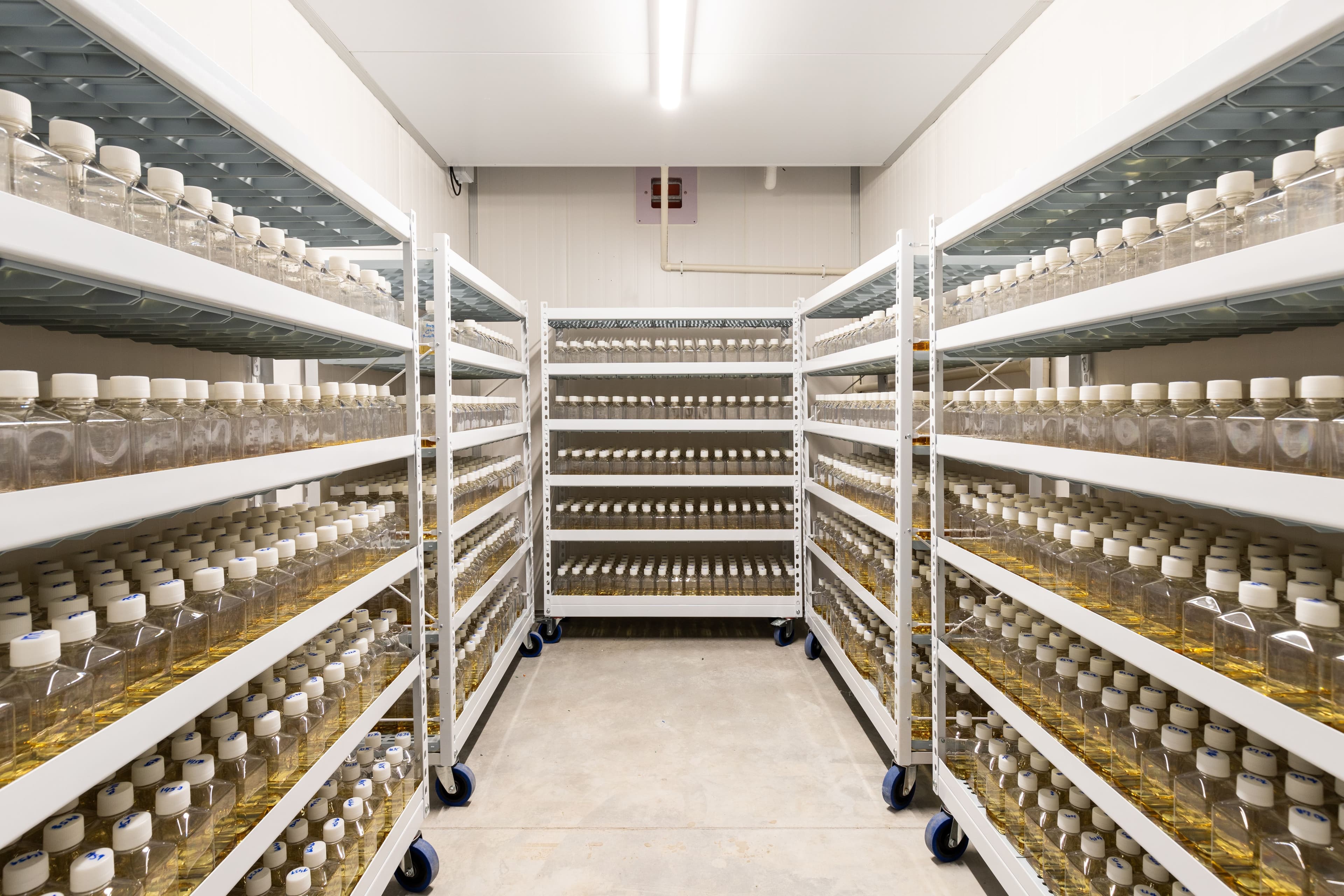 Industrial freezer storage units for temperature-sensitive materials