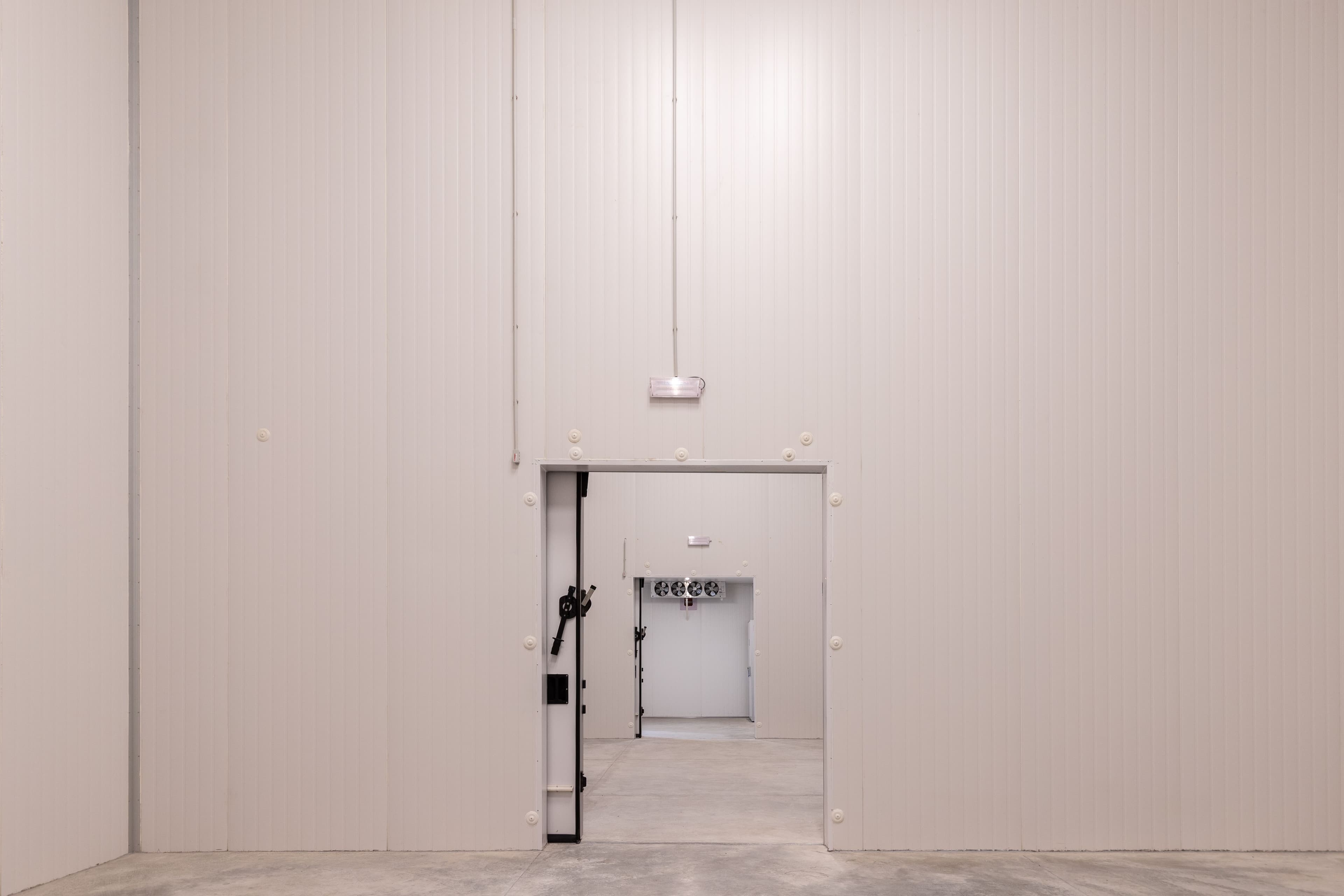 Primary refrigerated storage facility with temperature monitoring